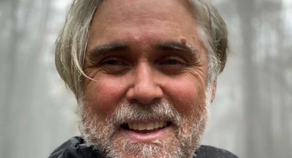 Profile picture of a man in a forest.
