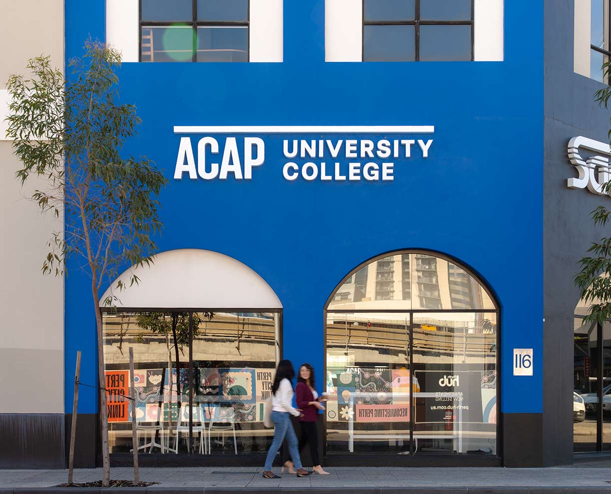 ACAP University College campus Perth - a large blue wall with two segmental-arch windows and the ACAP University College logo in white lettering